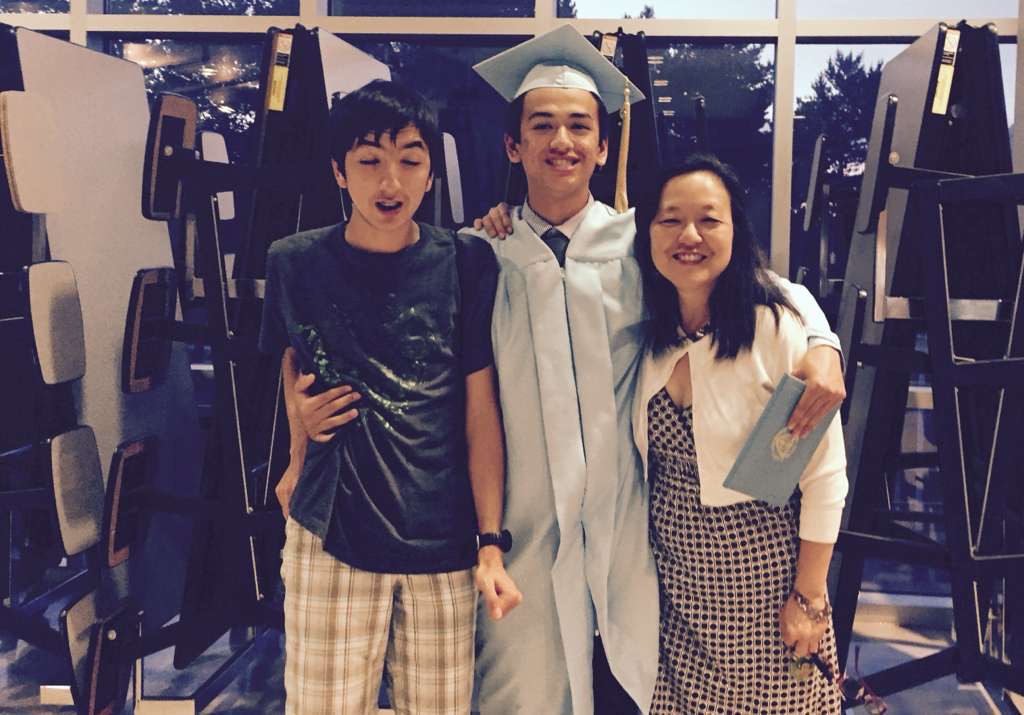 Alex at graduation with family